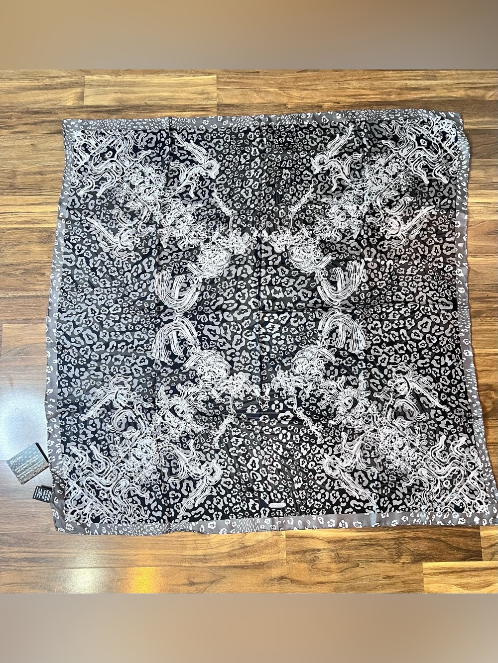 NWT 💯 silk scarf with Animal Print design.Measures 35 by 35 inches